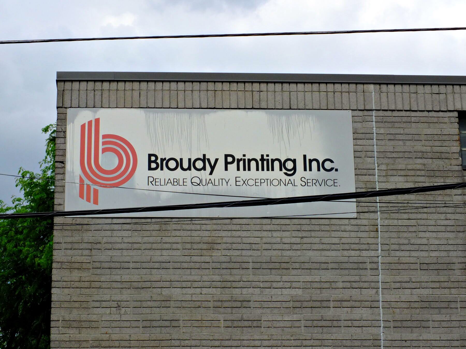 Broudy Printing Inc. sign on the plant exterior at 221 Auburn Street