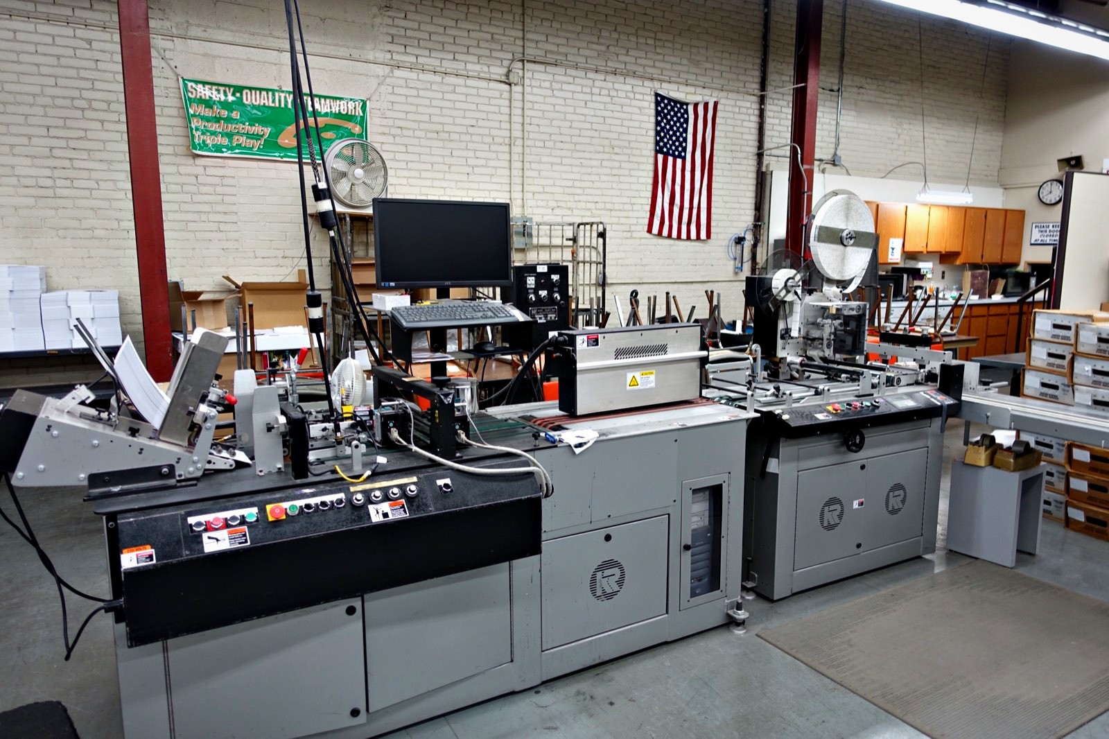 The inserting and addressing line running a mailing at Broudy Printing