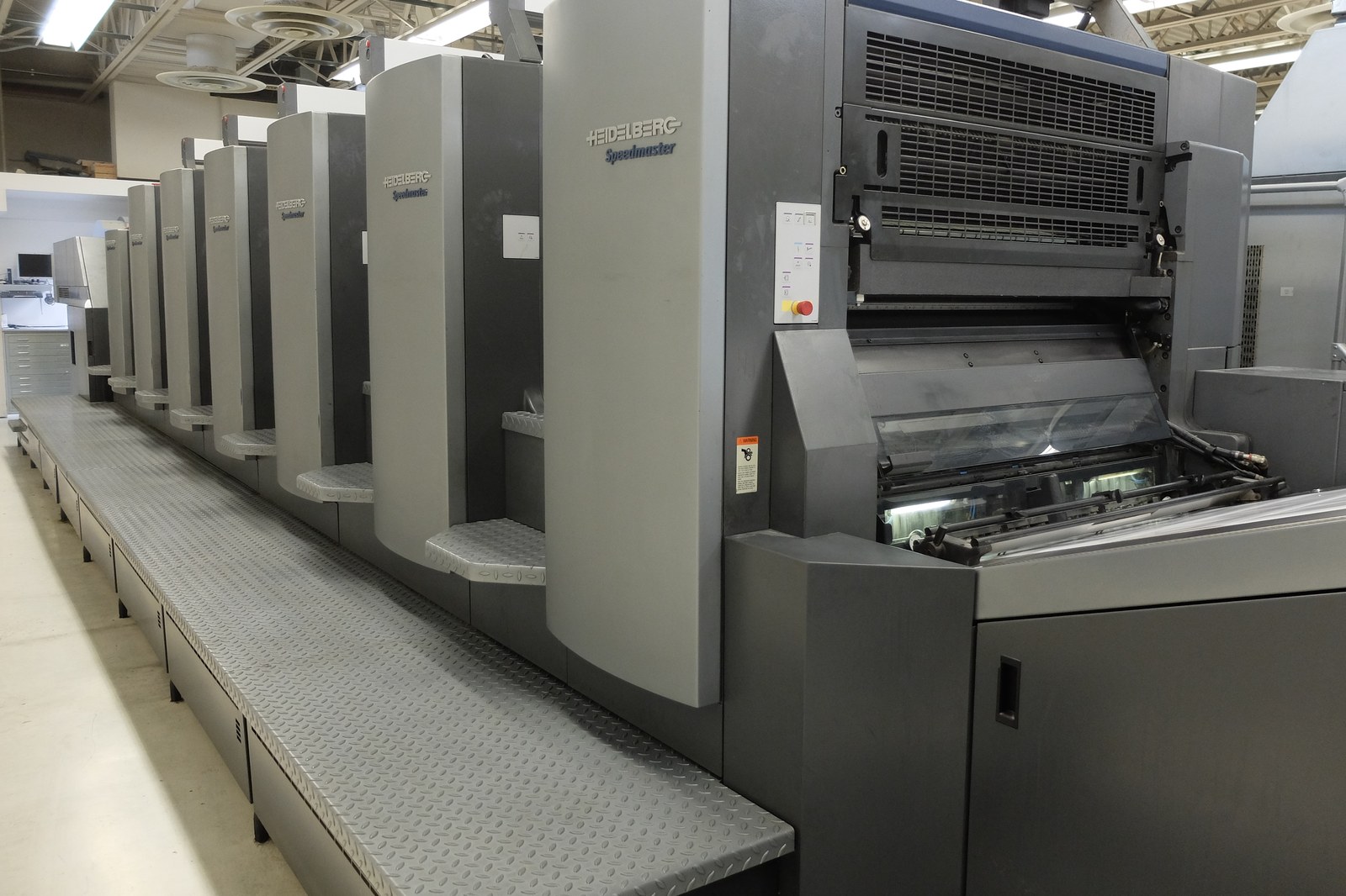 The six-color Heidelberg Speedmaster CD 102 with coating tower on the pressroom floor at Broudy Printing